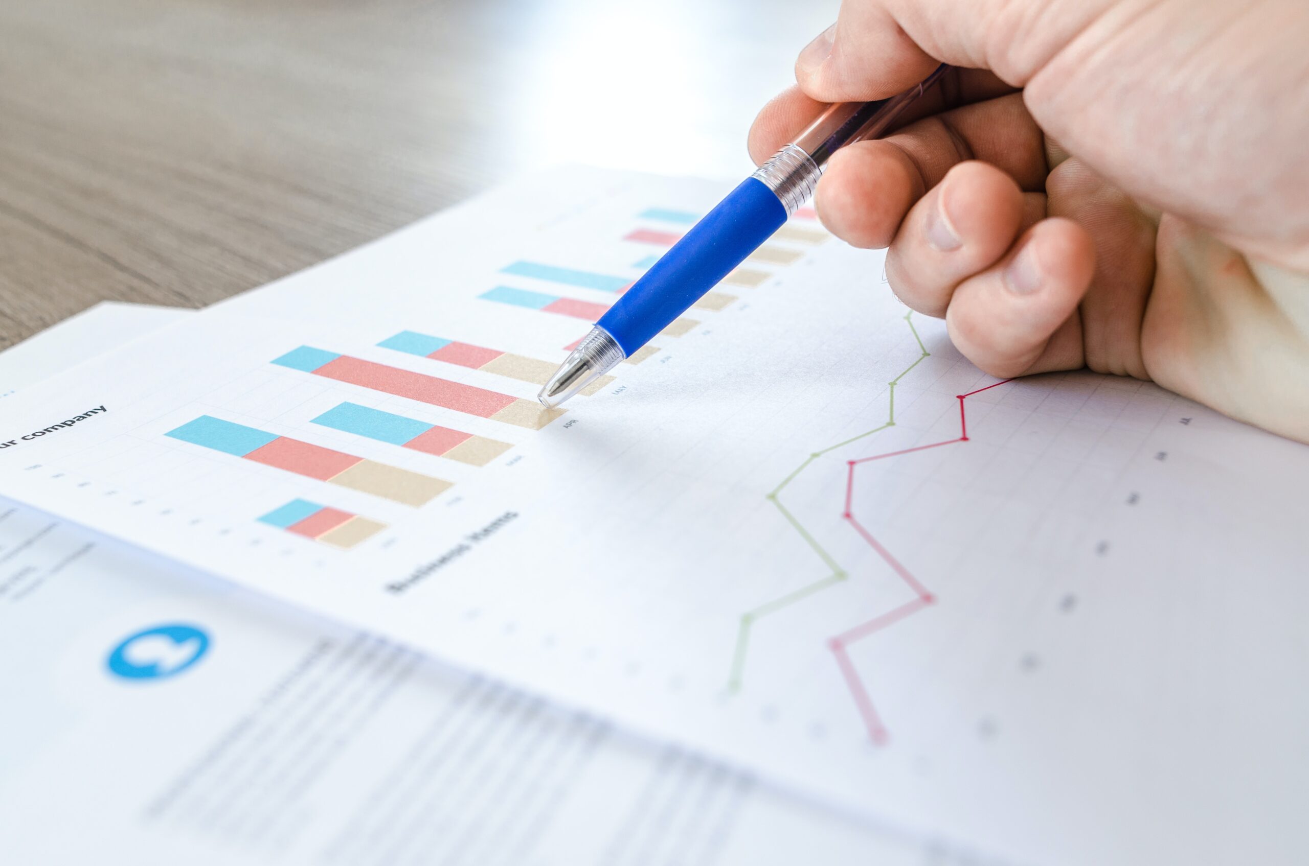 a pen points to a graph of data, the power of virtual receptionists