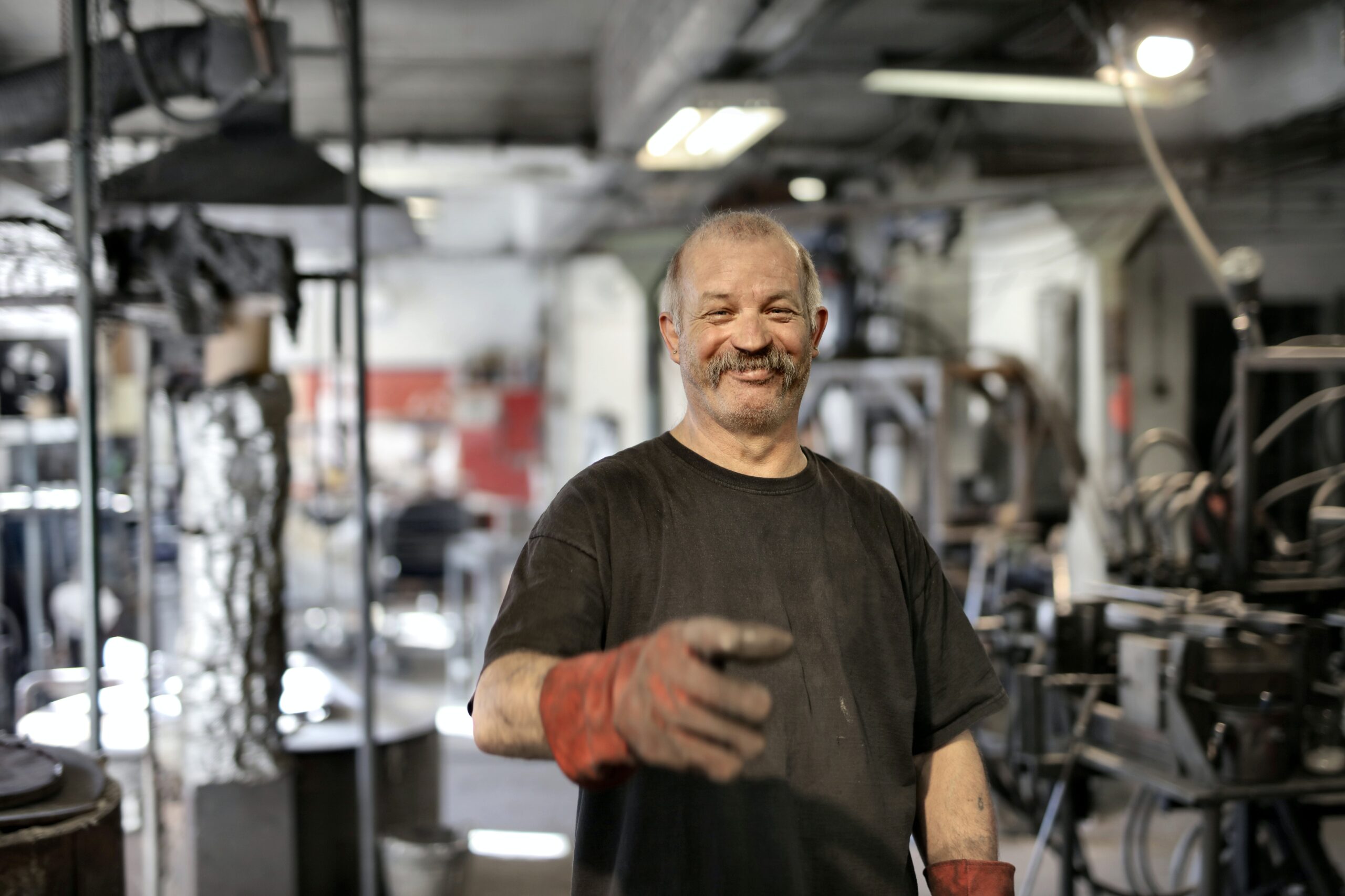 happy man in a small business repair shop