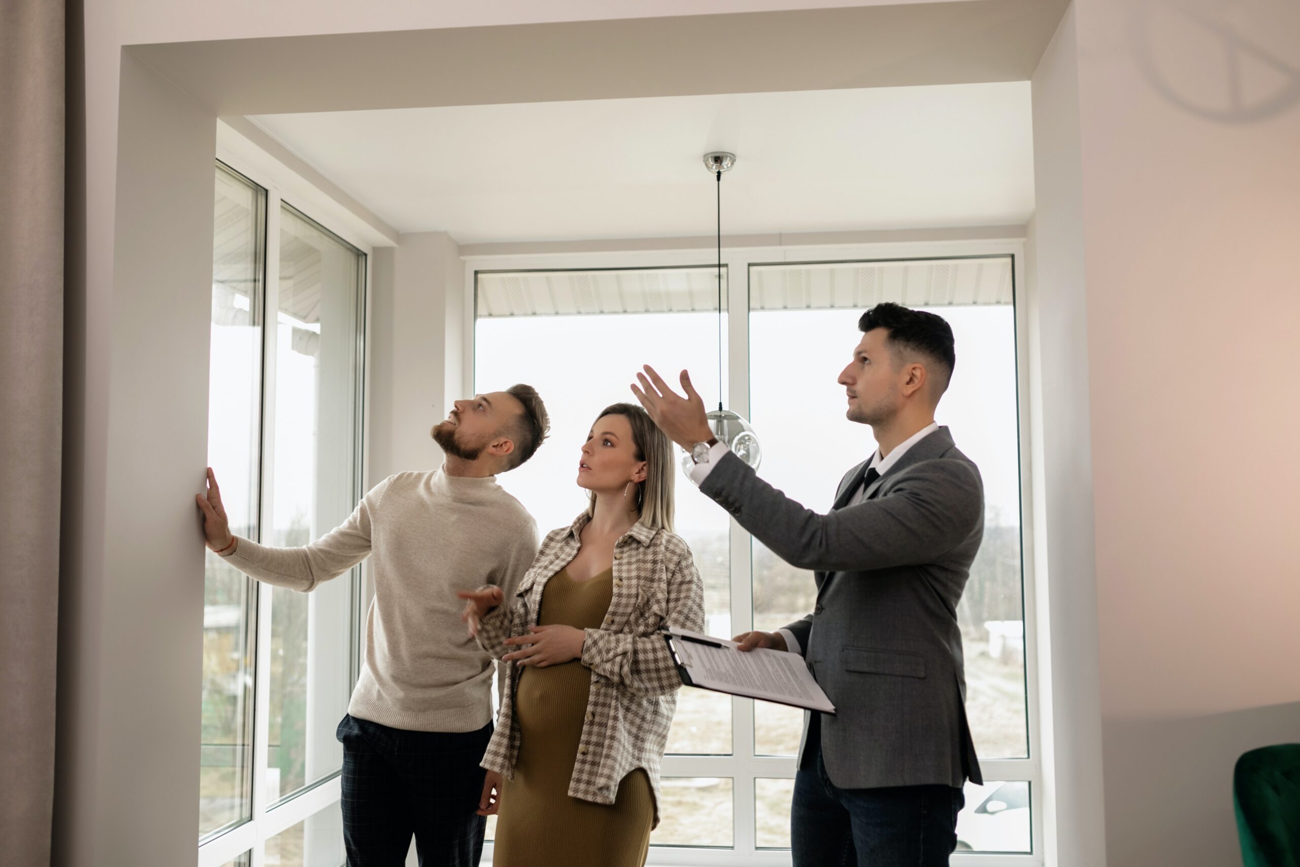 realtor showing a house to a man and woman, scaling made simple